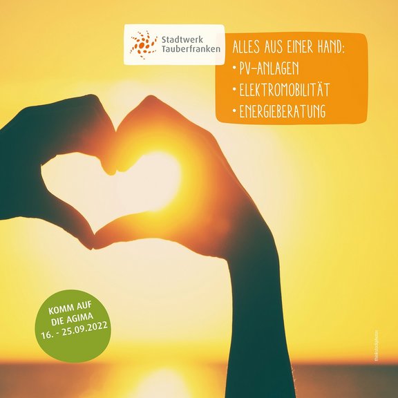 AGIMA 2 Hände bilden ein Herz, die Sonne ist im Hintergrund